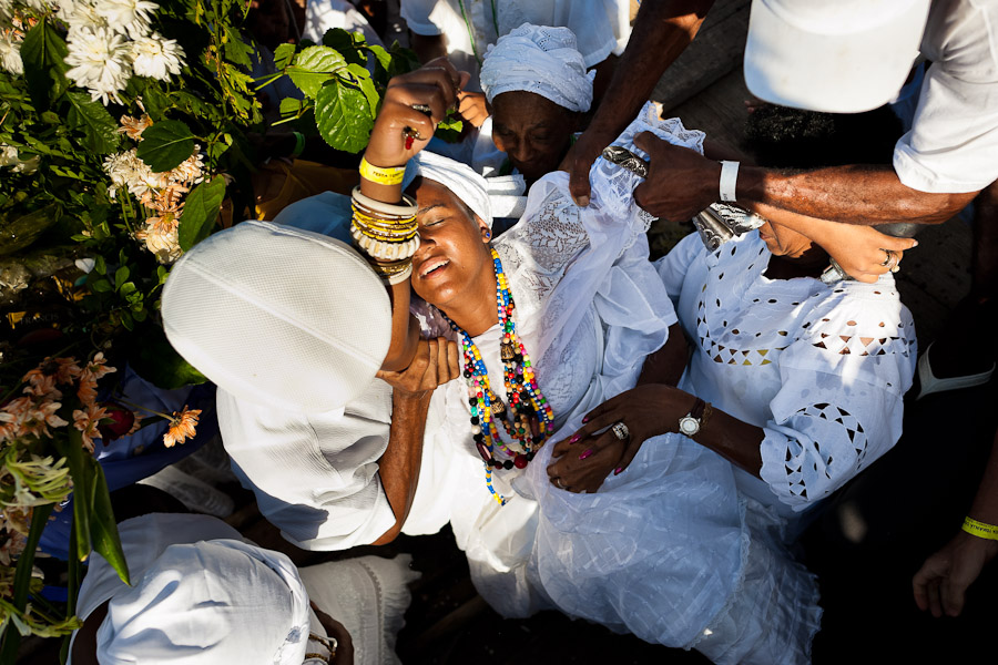 A Candomblé follower becomes possessed during the ritual ceremony in honor to Yemanjá, the goddess of the sea, in Cachoeira, Bahia, Brazil.