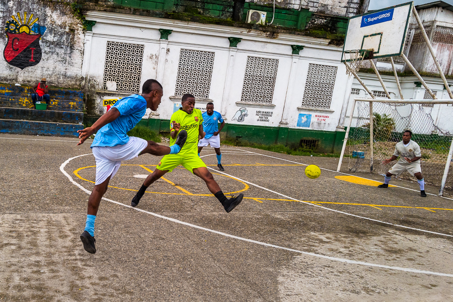 Young Afro-Colombian boys play football during the training session in Quibdó, Chocó, the Pacific department of Colombia.