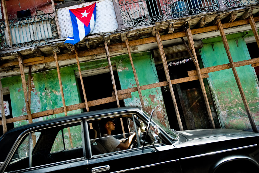 The old Russian car Lada Zhiguli (VAZ-2101) in front of a ruined house in Santiago de Cuba.